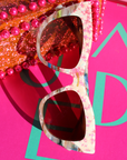 Kaleida ~ Pink two-tone cat-eye sunglasses with star glitter and multi-coloured patterned acetate