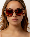 Aftersun ~ Medium sized square sunglasses in brown acetate with golden shimmer and bold crystal flower details