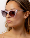 Chandalie ~ Sharp two-tone cat-eye sunglasses in iridescent glitter and silver sparkle acetate