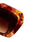 Fire Opal ~ Oversized oval sunglasses in red apricot tort acetate with matching crystal detailing