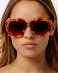 Fire Opal ~ Oversized oval sunglasses in red apricot tort acetate with matching crystal detailing