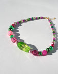 GUAVA GLOW ~ Handmade statement necklace featuring a green glitter centrepiece with emerald green and fuchsia beads