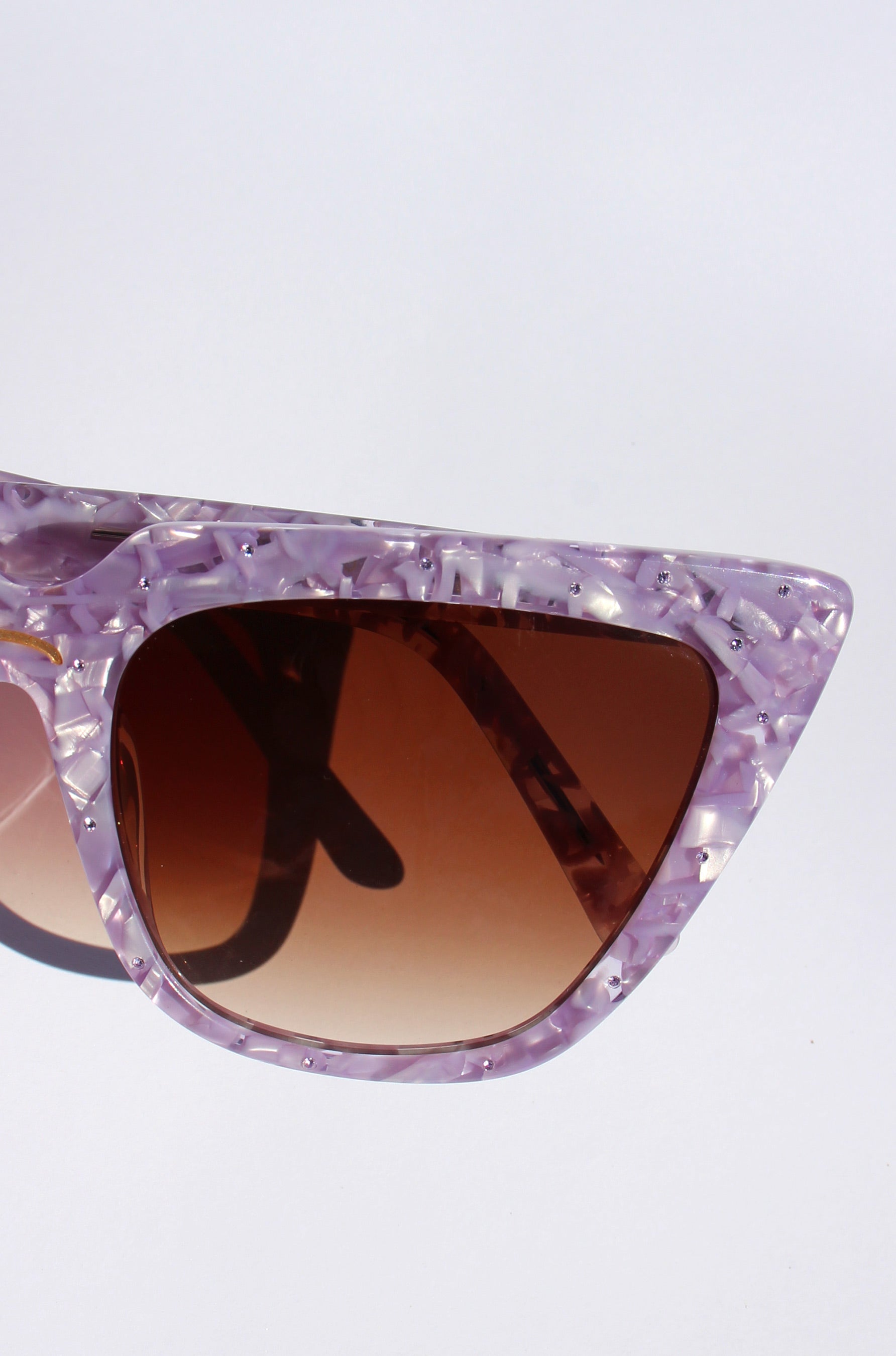 Lavara ~ Sharp cat-eye sunglasses in lilac marble with micro crystal detailing