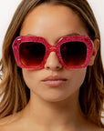 Rosinite ~ Oversized pink oval sunglasses in glitter acetate with fuchsia crystal detailing