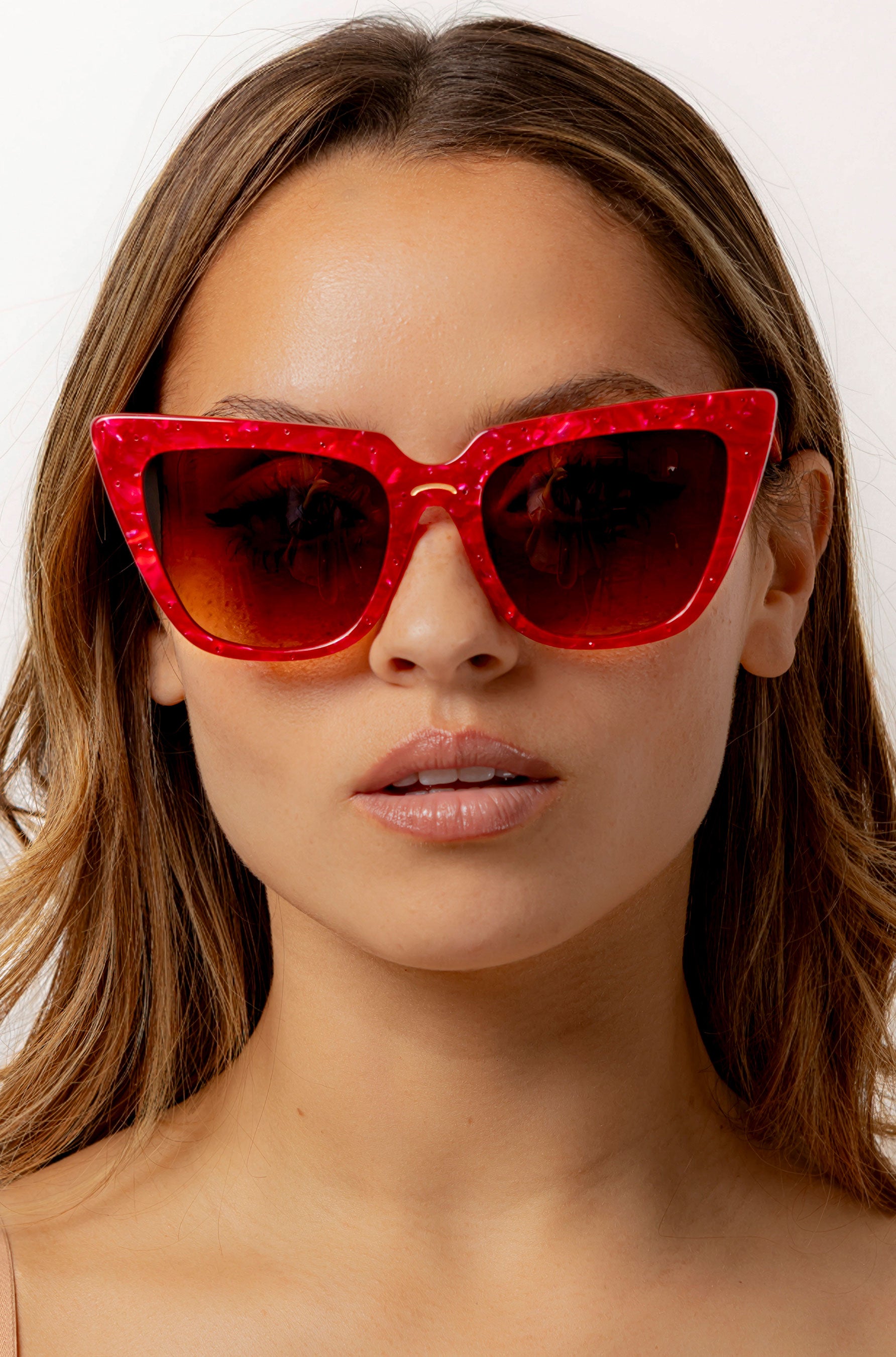 Rubie ~ Sharp cat-eye sunglasses in red marble with micro crystal detailing