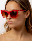 Rubie ~ Sharp cat-eye sunglasses in red marble with micro crystal detailing