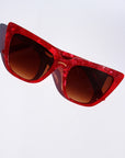 Rubie ~ Sharp cat-eye sunglasses in red marble with micro crystal detailing