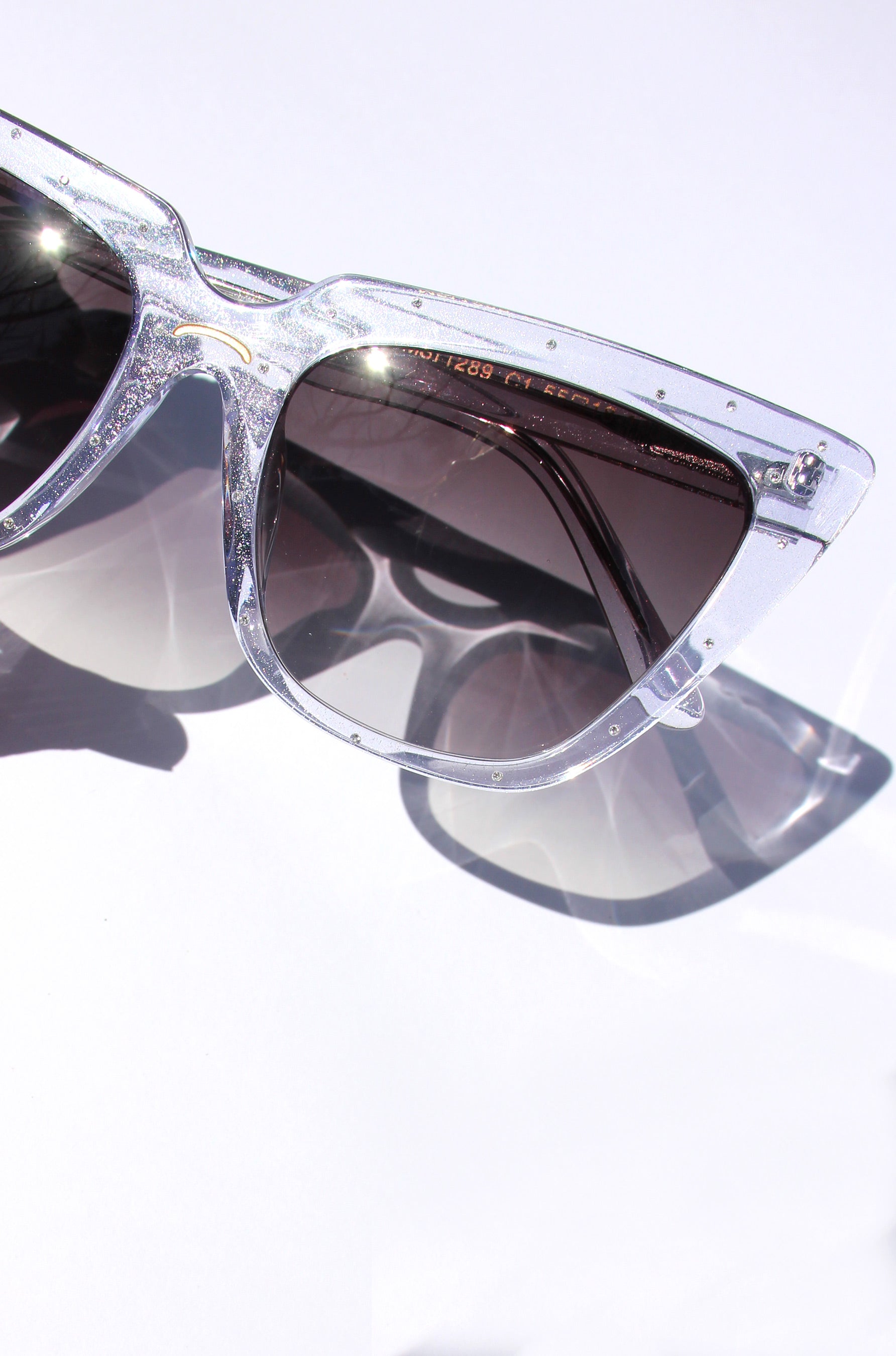 Stardust ~ Sharp cat-eye sunglasses in pearl tortoise shell with micro opal crystal detailing