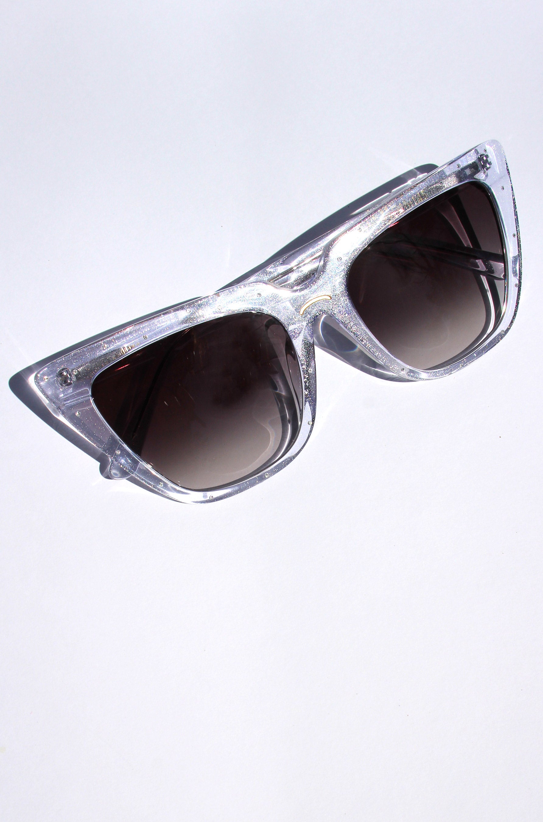 Stardust ~ Sharp cat-eye sunglasses in clear shimmer with micro