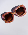 Sunrose ~ Medium sized square sunglasses in petal acetate with golden highlights and crystal flower details