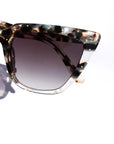 Tortelle ~ Sharp cat-eye sunglasses in pearl tortoise shell with micro opal crystal detailing
