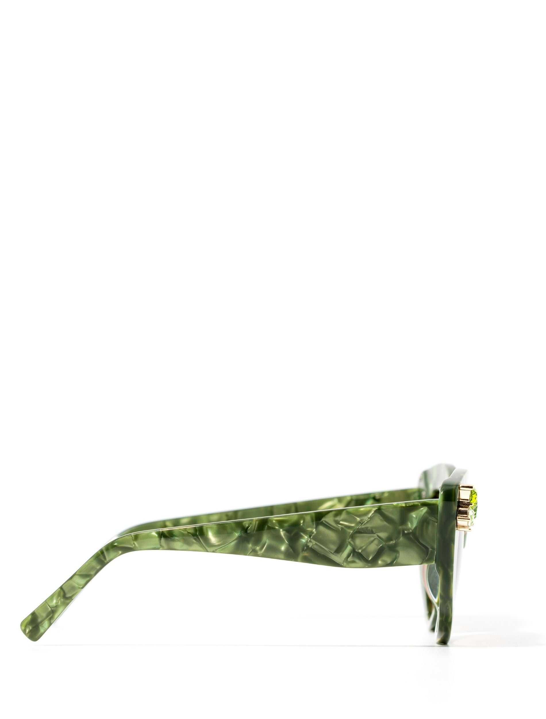 Front view of stunning cat eye sunglasses crafted with a green pearlescent look, featuring gemstone embellishments on the upper corners of the frame. Set against a white backdrop