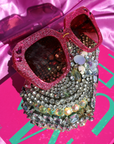 Rosinite ~ Oversized pink oval sunglasses in glitter acetate with fuchsia crystal detailing