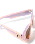 top view of stylish pair of pastel pink and lilac sunglasses with a brown gradient lense set against a white background. there is a gold 'M' on the arm of the frame.