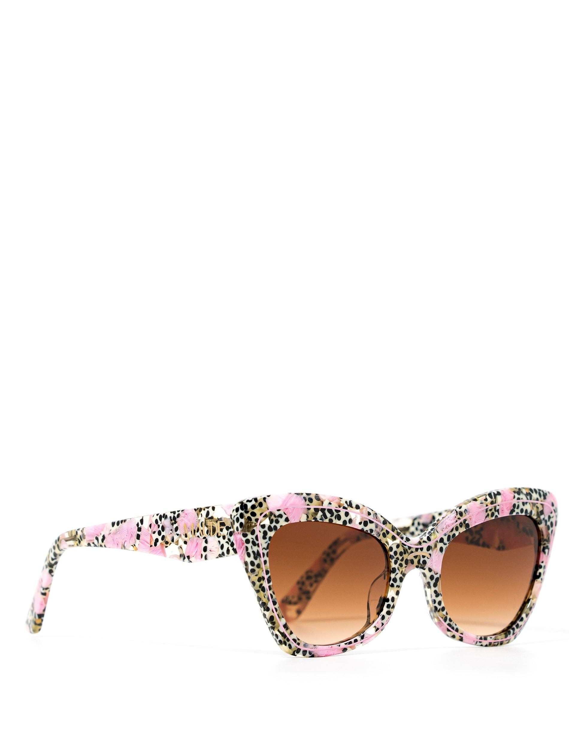 Side view of a stylish cat eye sunglasses featuring a chic leopard print and a brown gradient lense.