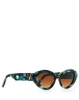 side view of a pair of stylish sunglasses in a green tortoise shell style displaced against a white back drop. the lenses are a gradient brown. You can see an embellished 'M' on the side of the frame arm