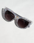 Chandalie ~ Sharp two-tone cat-eye sunglasses in iridescent glitter and silver sparkle acetate