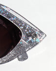 Chandalie ~ Sharp two-tone cat-eye sunglasses in iridescent glitter and silver sparkle acetate
