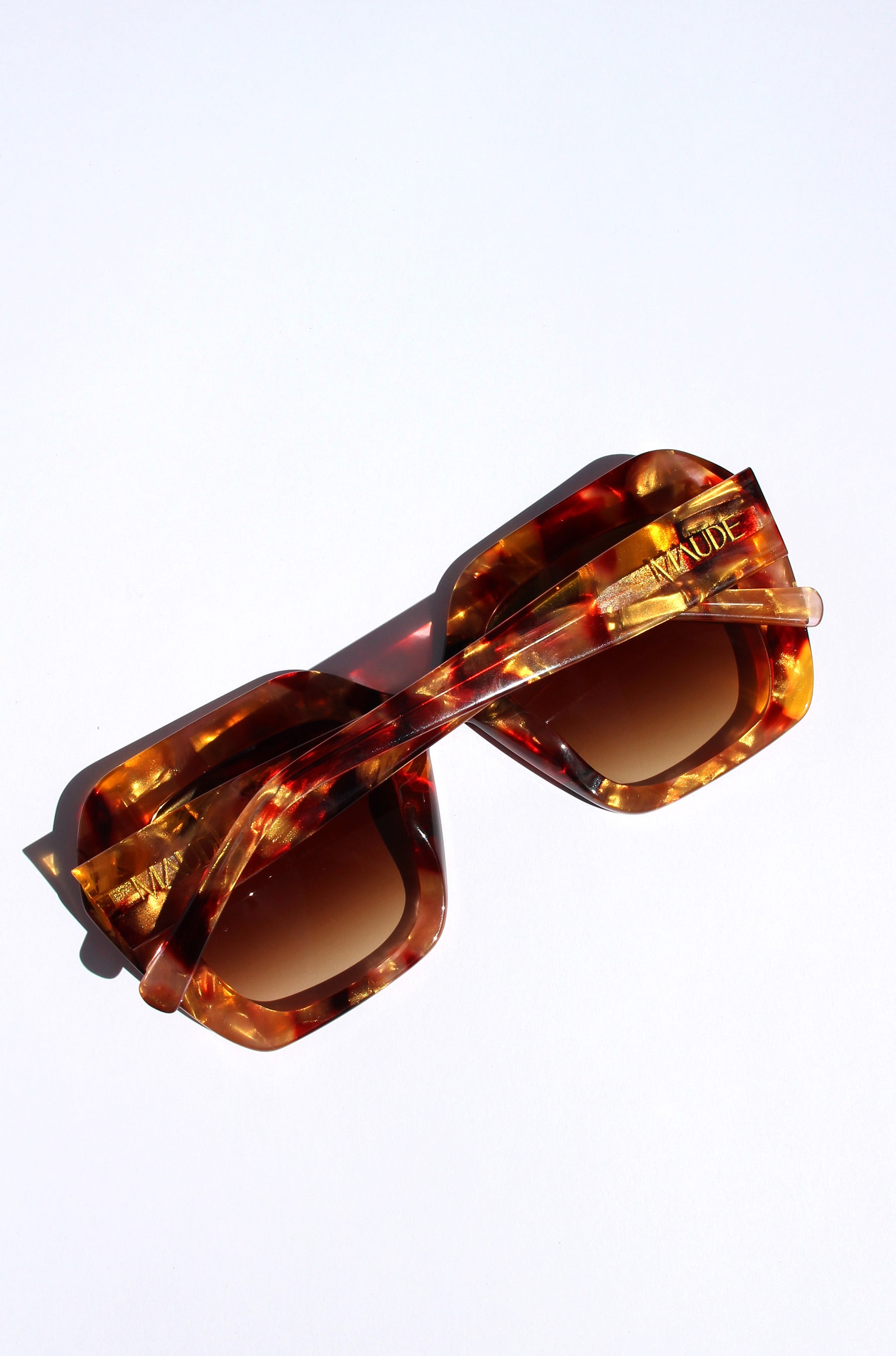 Fire Opal ~ Oversized oval sunglasses in red apricot tort acetate with matching crystal detailing