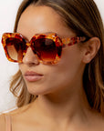 Fire Opal ~ Oversized oval sunglasses in red apricot tort acetate with matching crystal detailing