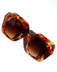 Fire Opal ~ Oversized oval sunglasses in red apricot tort acetate with matching crystal detailing