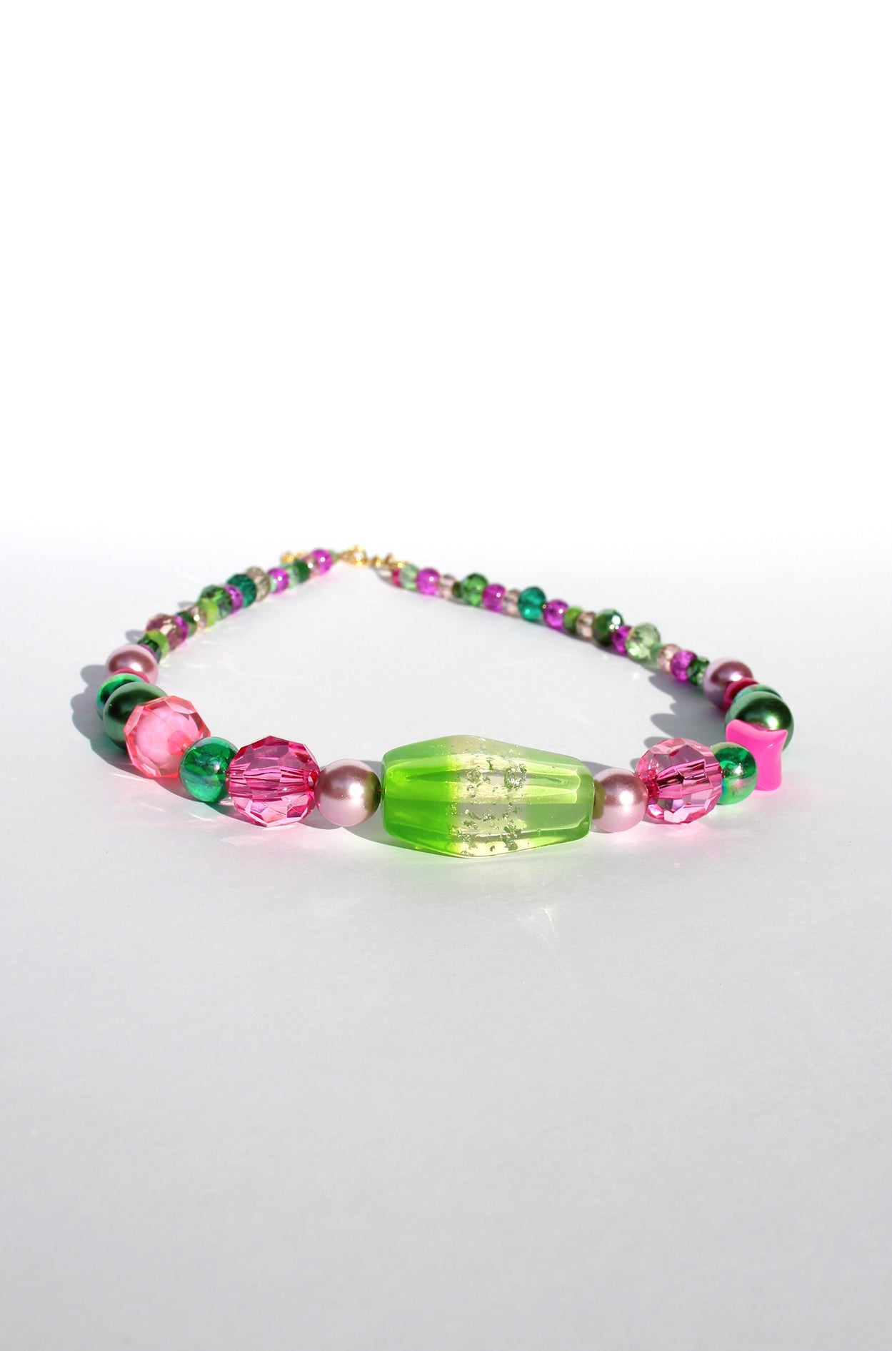 GUAVA GLOW ~ Handmade statement necklace featuring a green glitter centrepiece with emerald green and fuchsia beads