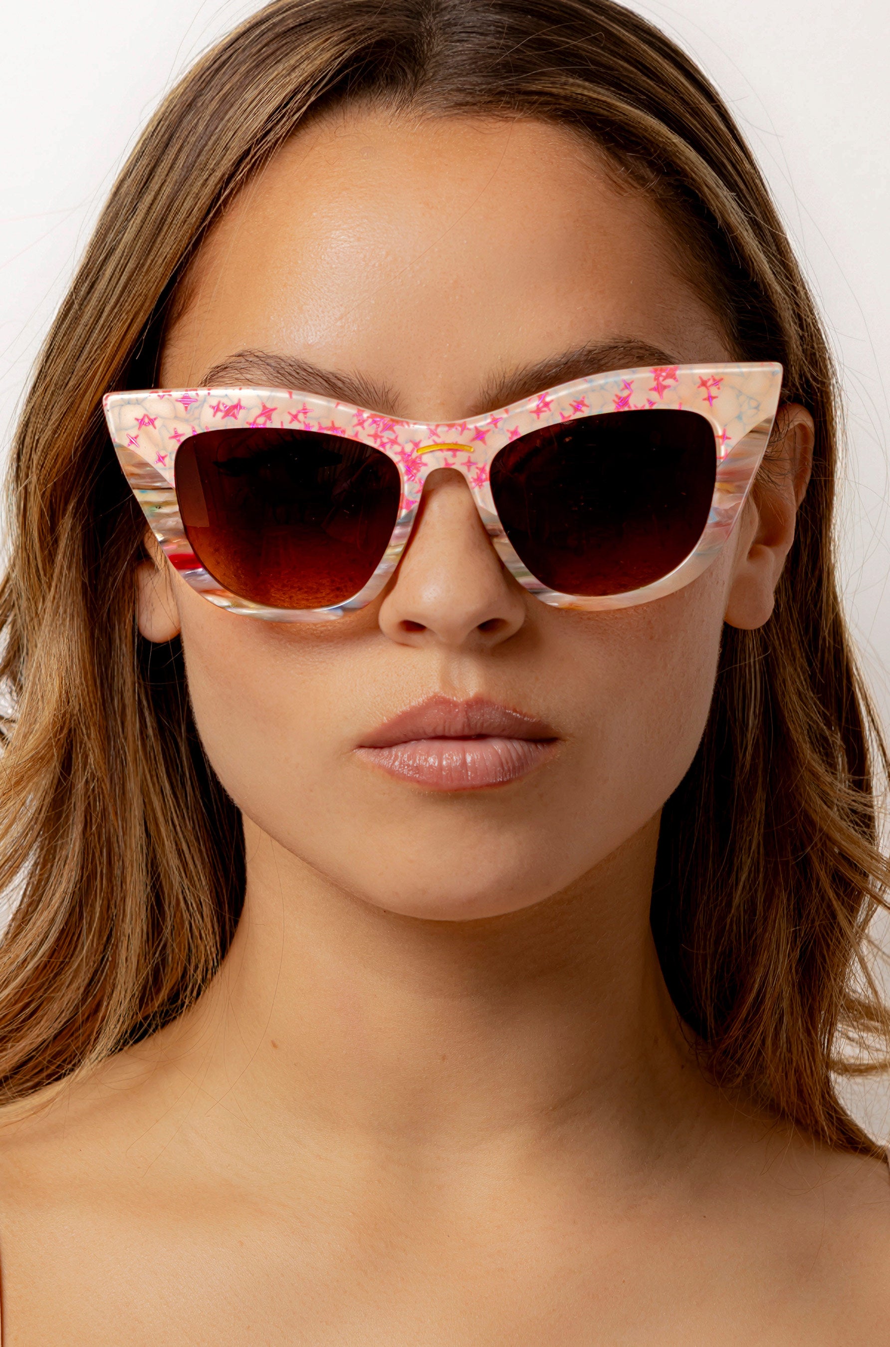 Kaleida ~ Pink two-tone cat-eye sunglasses with star glitter and multi-coloured patterned acetate