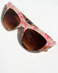 Kaleida ~ Pink two-tone cat-eye sunglasses with star glitter and multi-coloured patterned acetate