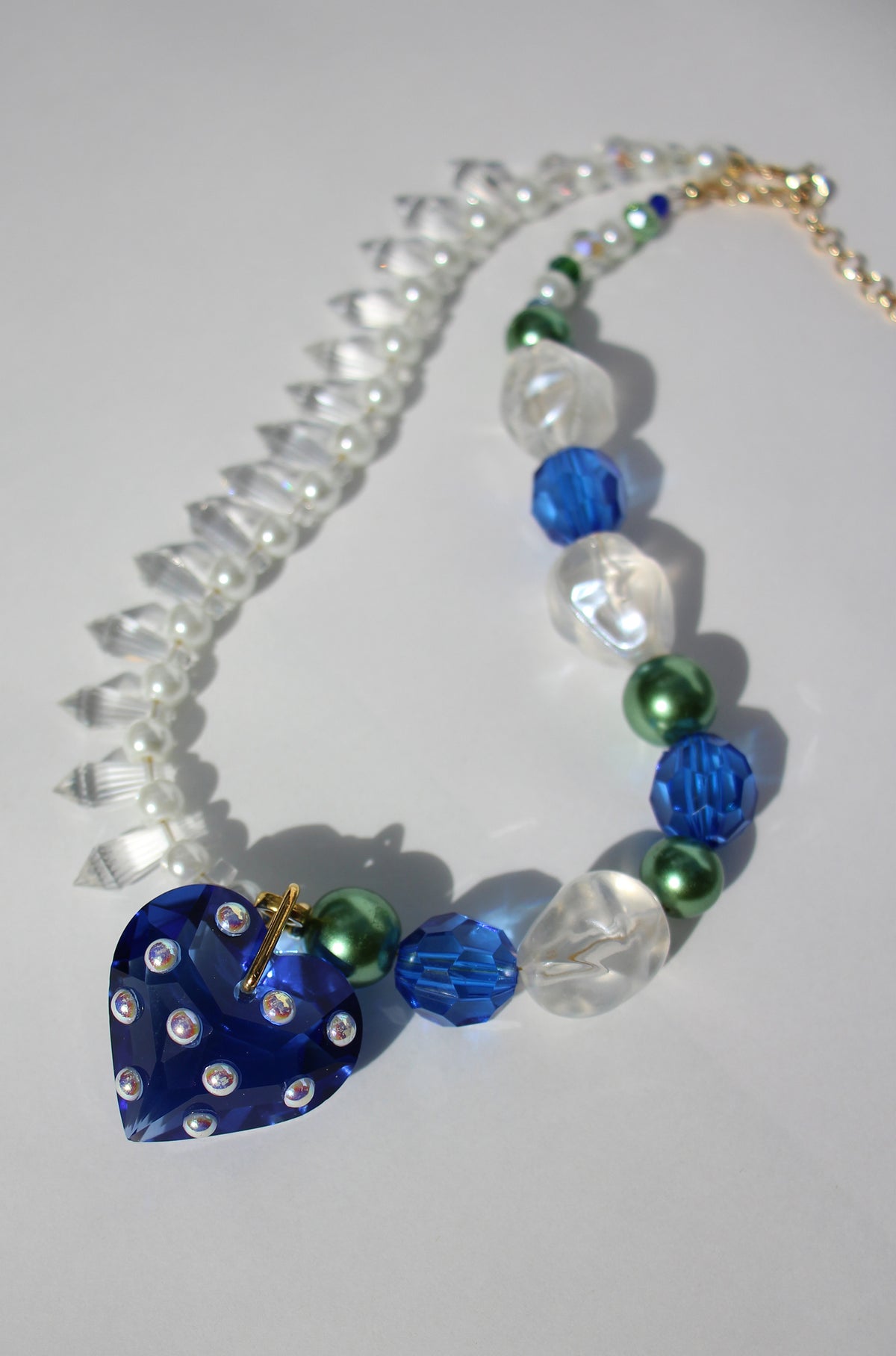 LOVELING ~ Blue crystal heart handmade necklace with statement chandelier crystals, green pearl beads and oversized faceted blue beads