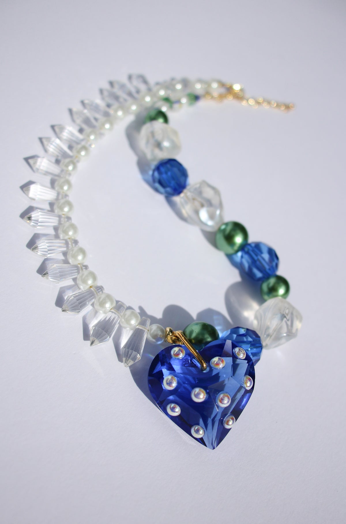 LOVELING ~ Blue crystal heart handmade necklace with statement chandelier crystals, green pearl beads and oversized faceted blue beads