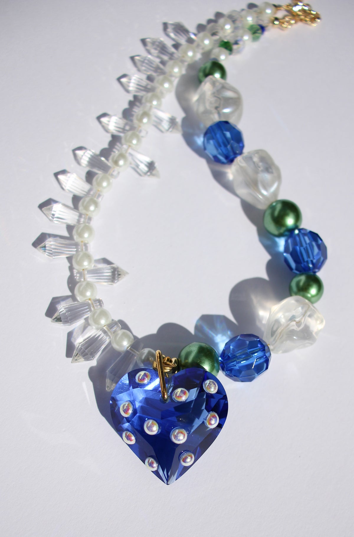 LOVELING ~ Blue crystal heart handmade necklace with statement chandelier crystals, green pearl beads and oversized faceted blue beads