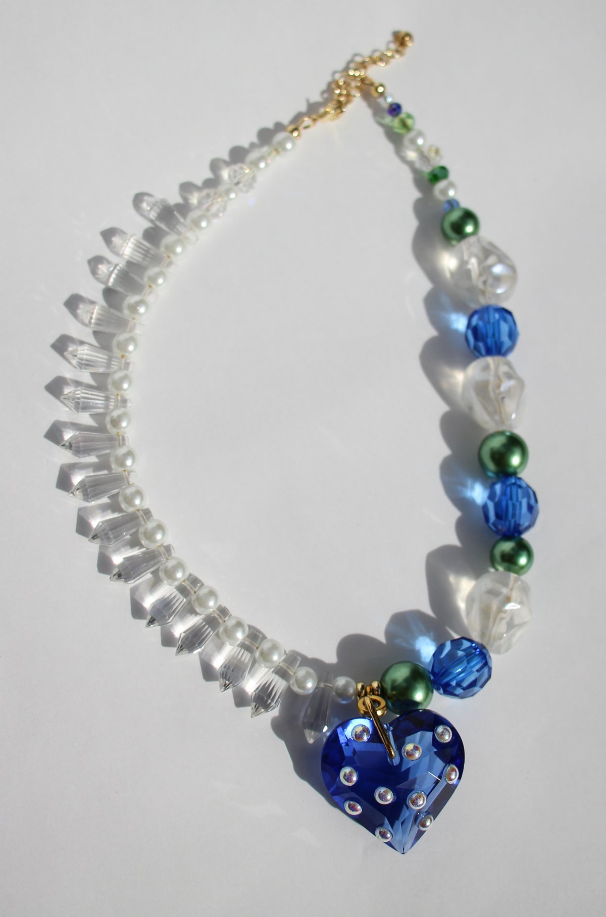 LOVELING ~ Blue crystal heart handmade necklace with statement chandelier crystals, green pearl beads and oversized faceted blue beads