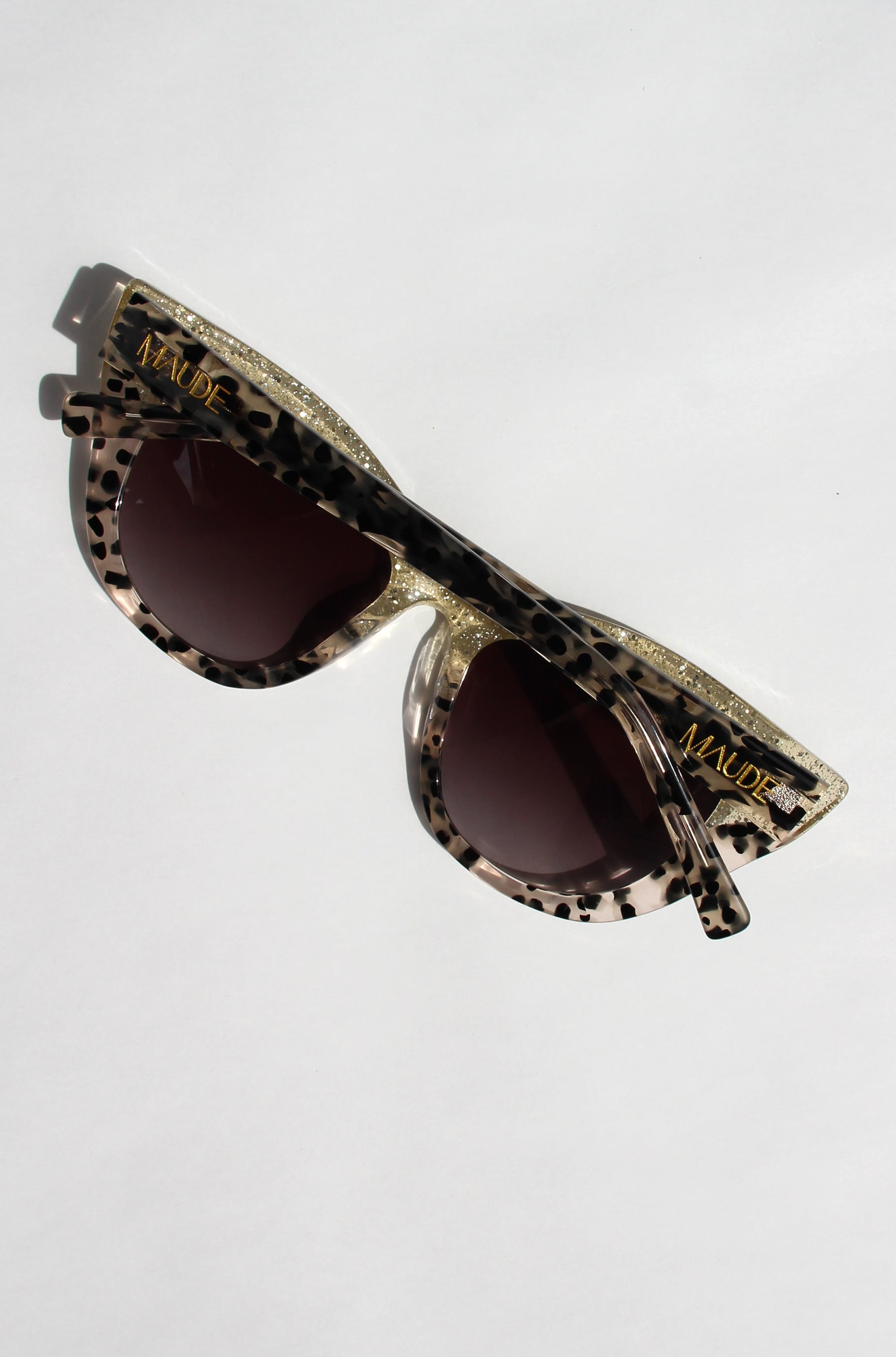 Queenie ~ Two-toned cat-eye sunglasses in gold glitter and translucent black polkadot acetate