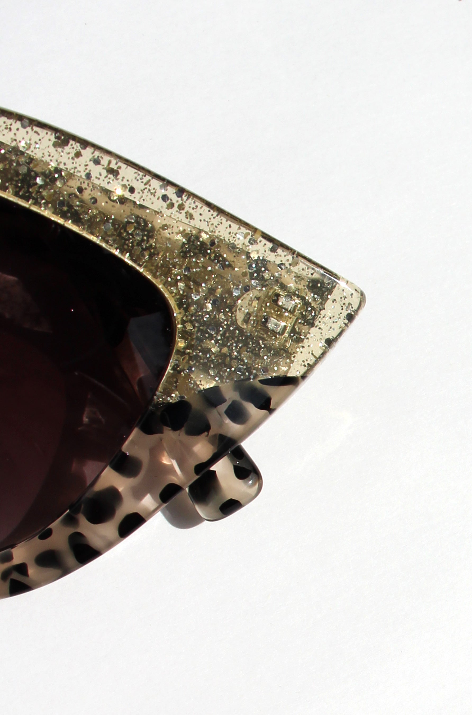 Queenie ~ Two-toned cat-eye sunglasses in gold glitter and translucent black polkadot acetate
