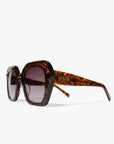 Tigers Eye ~ Oversized oval sunglasses in silver glitter tort acetate with coffee crystal detailing