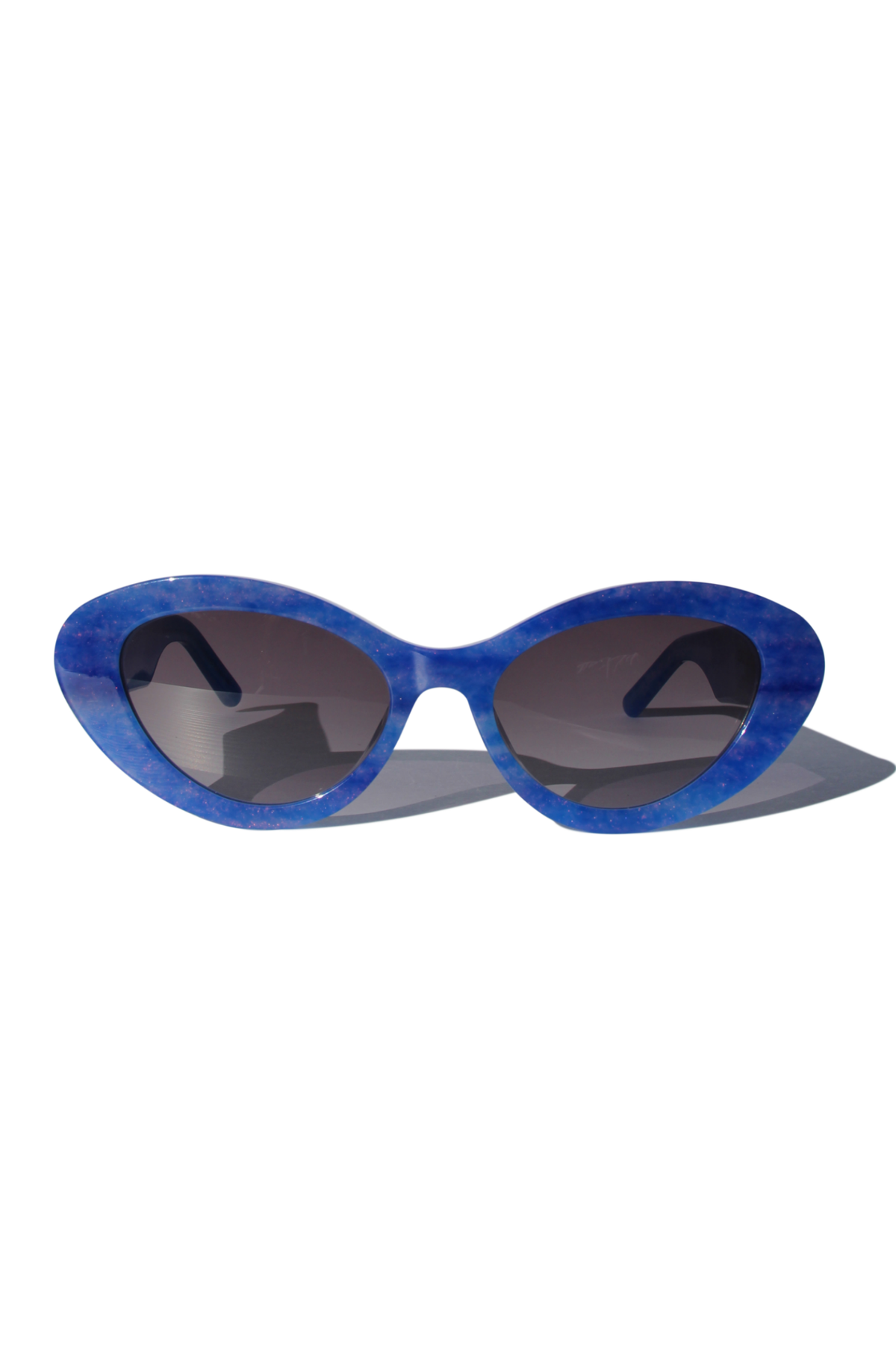 AZURIA ~ Oval shaped sunglasses in a luminous imperial blue with pink shimmer