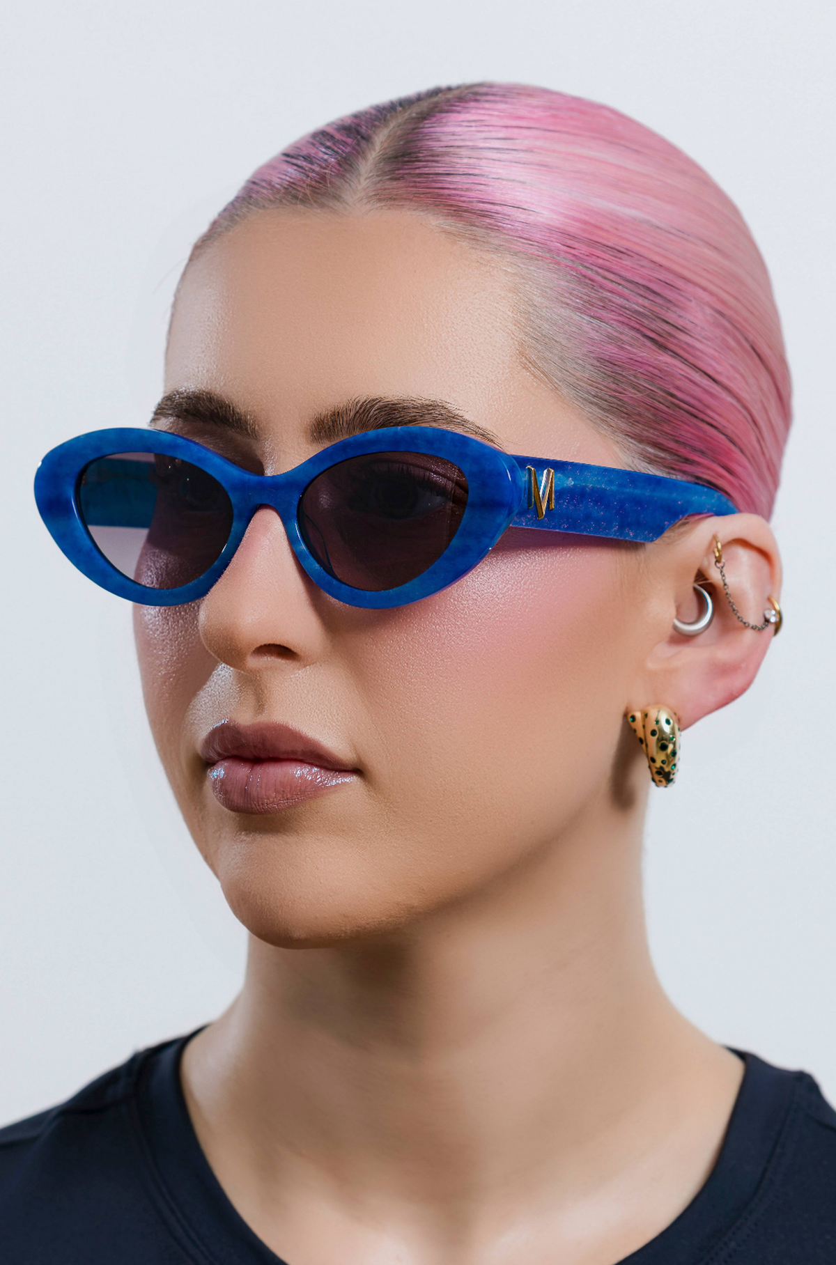 AZURIA ~ Oval shaped sunglasses in a luminous imperial blue with pink shimmer