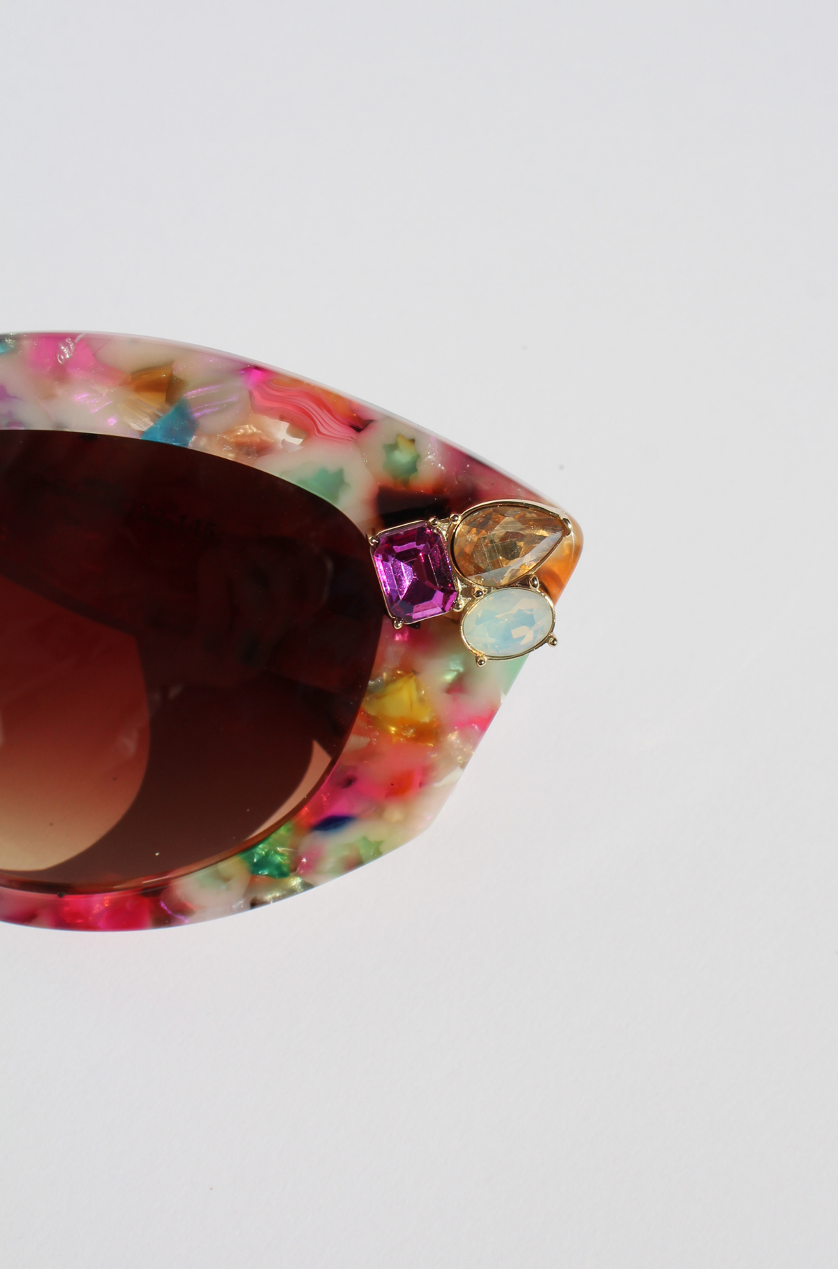 CALYPSO ~ Modern cateye sunglasses in a vibrant multicoloured acetate with crystal embellishments
