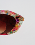 CALYPSO ~ Modern cateye sunglasses in a vibrant multicoloured acetate with crystal embellishments