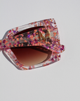 GLITTERATI ~ Square shaped sunglasses in silver glitter with a confetti of pink hearts and peach sequins