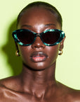 Glowella ~ Oval shaped Emerald green flecked sunglasses