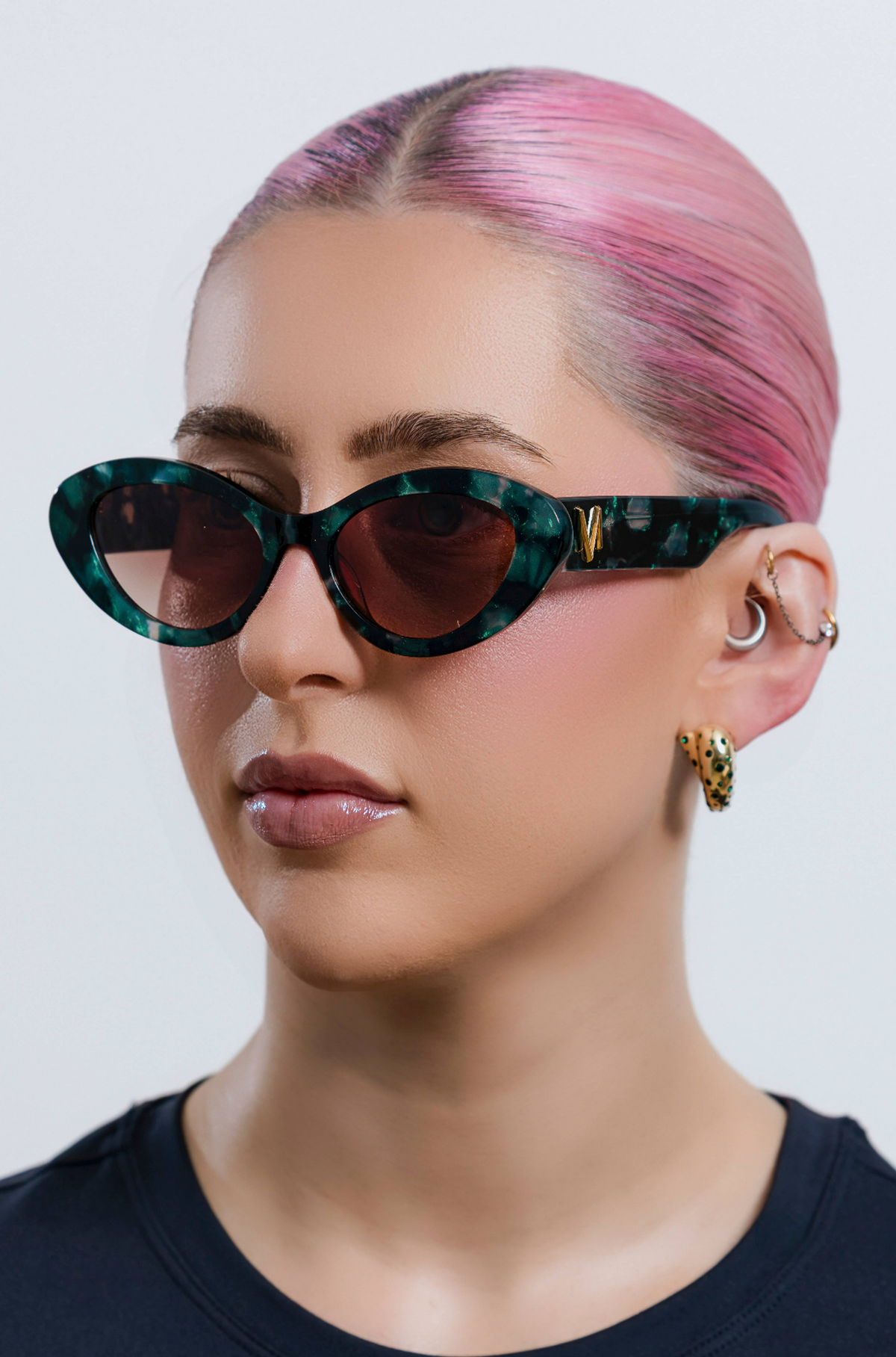 GLOWELLA ~ Oval shaped sunglasses in dark green with shimmering emerald tort