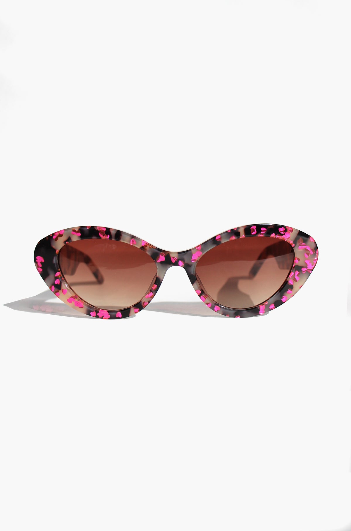 JEWELISSA ~ Oval shaped sunglasses in tortoiseshell acetate sprinkled with vibrant pink hearts