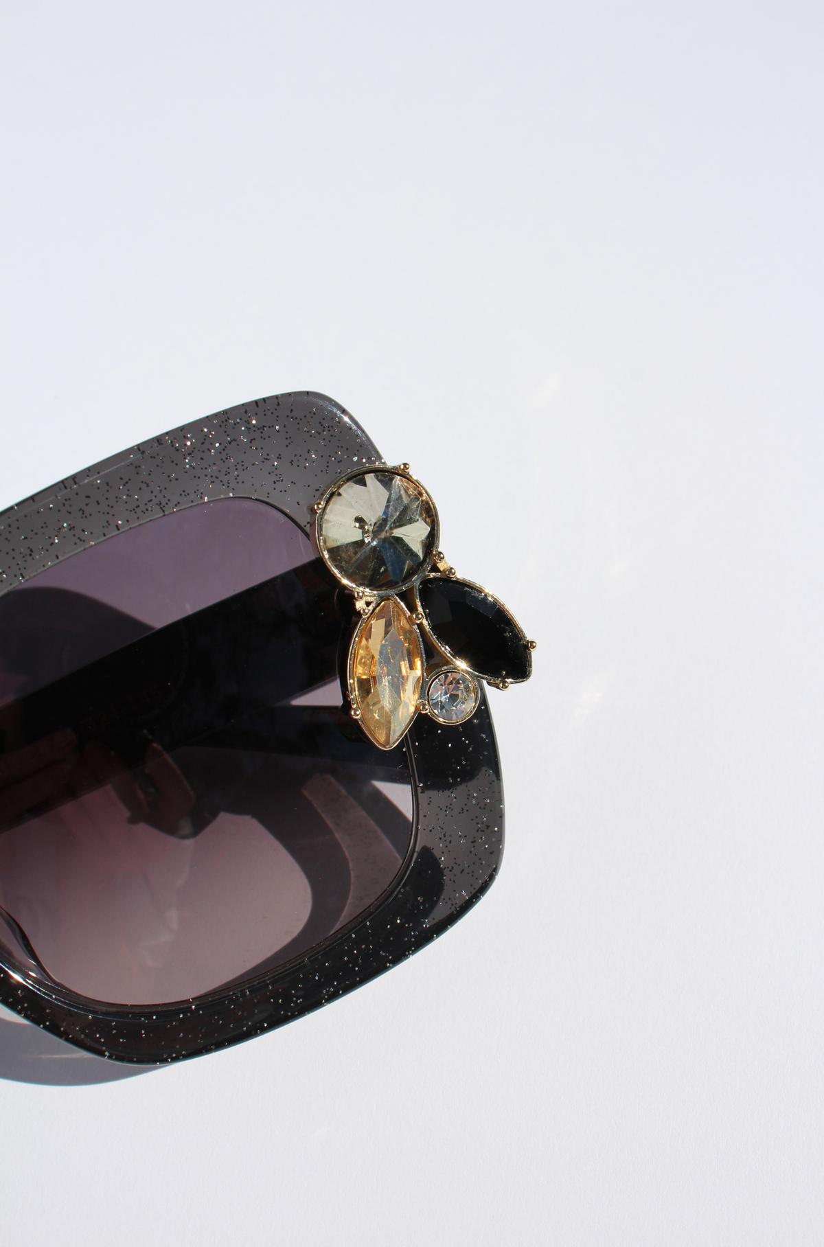 LIQUORICH ~ Oversized rounded square sunglasses in luminous black glitter acetate with crystal embellishments