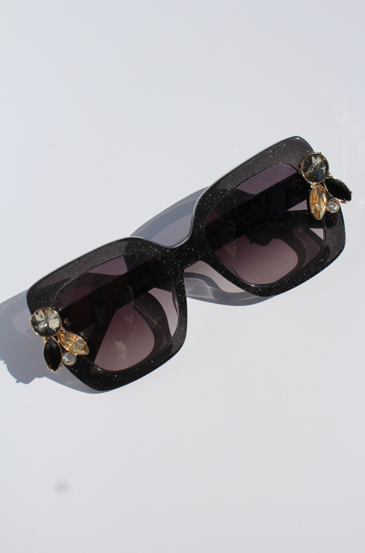 LIQUORICH ~ Oversized rounded square sunglasses in luminous black glitter acetate with crystal embellishments