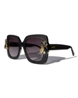 LIQUORICH ~ Oversized rounded square sunglasses in luminous black glitter acetate with crystal embellishments