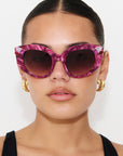 RUBEYE ~ Modern cateye sunglasses in a radiant marbled crimson acetate with crystal embellishments
