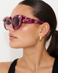RUBEYE ~ Modern cateye sunglasses in a radiant marbled crimson acetate with crystal embellishments