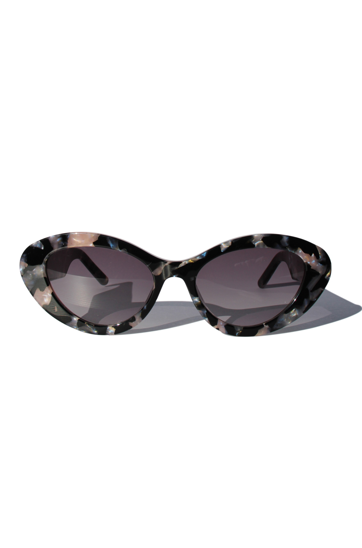 ONYX NOIR ~ Oval shaped sunglasses in marbled black and blush with shimmering turquoise acetate