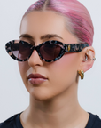 ONYX NOIR ~ Oval shaped sunglasses in marbled black and blush with shimmering turquoise acetate